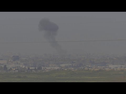 Black smoke clouds rise and drift over northern Gaza as Israeli offensive goes on