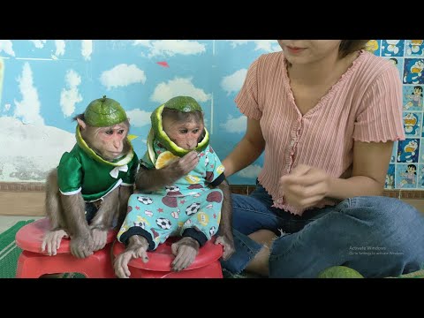 Mimi Kuku duo wearing orange hats made by Mom