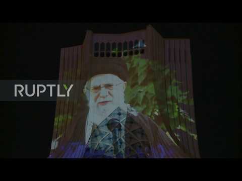 Iran: Tehran's Azadi Tower lit up with messages of solidarity amid coronavirus crisis