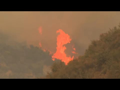 Thousands evacuate as wildfires rage outside Los Angeles