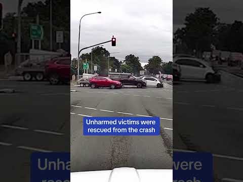 WILD moment a car flies through stop light at intersection