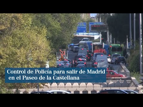 Control de Policía para salir de Madrid en el Paseo de la Castellana