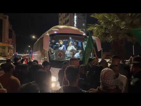 Bus carrying freed Palestinian prisoners drives through Beitunia, edging closer to reunion with fami