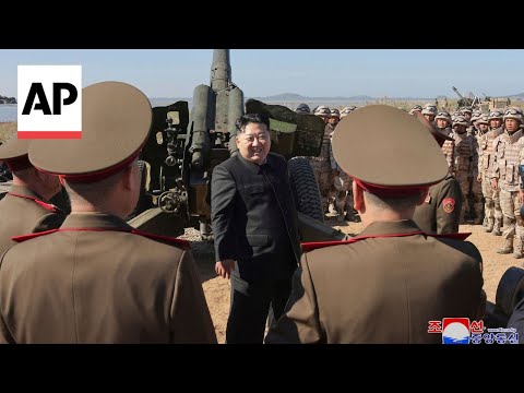 North Korea releases images of Kim Jong Un watching artillery firing exercise