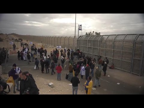 Dozens of Israelis protest near border crossing against delivering aid into Gaza