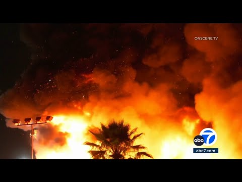 Massive fire erupts at RV dealership in Santa Fe Springs