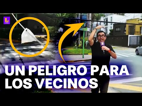 Cable caído es un peligro en Miraflores: Los mismos vecinos pusieron bolsas para levantarlo
