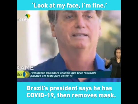 Bolsonaro takes off mask after telling reporters he has COVIID-19