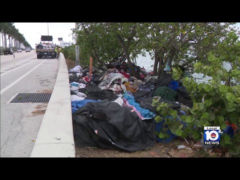 Crews with FDOT arrive along MacArthur Causeway to clear out mounds of trash
