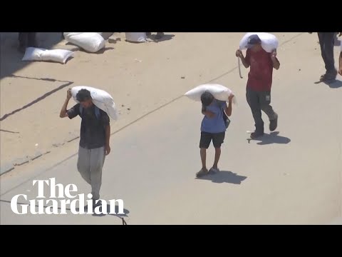 People rush for aid in Gaza as pressure on Israel grows