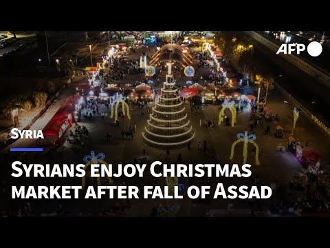 Syrians enjoy Christmas market after ousting of Assad | AFP