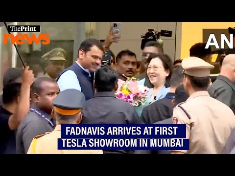 Maharashtra CM Fadnavis arrives at Tesla showroom to be inaugurated in Mumbai
