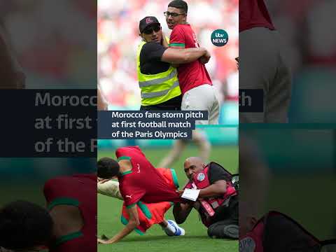 Morocco fans swarmed onto the pitch in protest against a late equaliser from Argentina  #itvnews