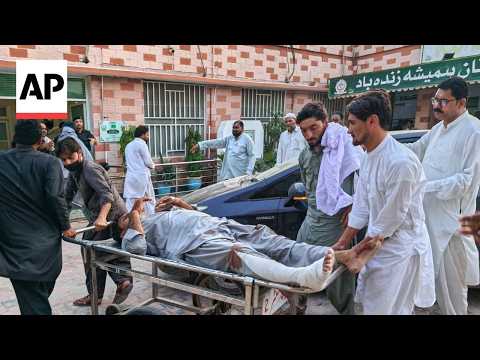 Injured brought to hospital in Pakistan after suicide bombing at checkpoint kills 12