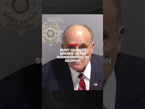 Rudy Giuliani speaks after surrendering in Georgi