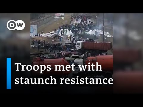 Footage shows how citizens try to stall Russian forces all over Ukraine | DW News