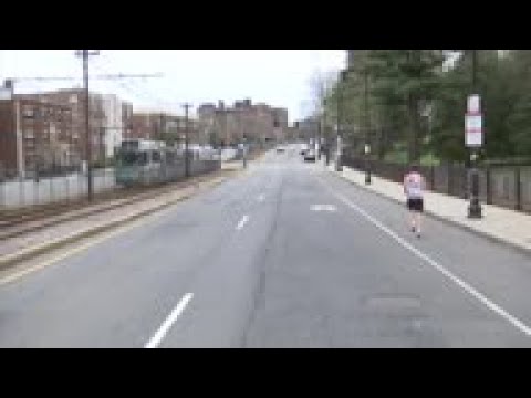 Lone racer runs along empty Boston Marathon route