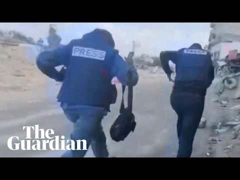 ‘They’re shooting towards us’: journalists run from gunfire in Gaza