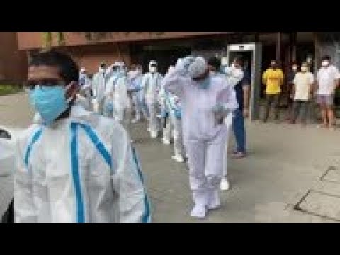 Health workers conduct testing in Mumbai