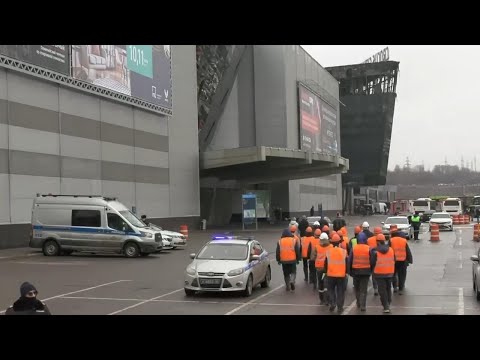 Emergency workers arrive at destroyed Moscow concert hall