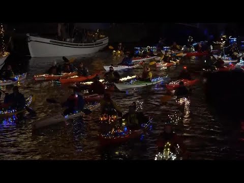 Festive kayakers light up Copenhagen canals for Santa Lucia parade