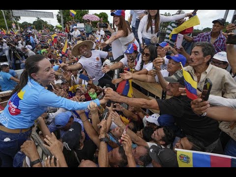 Venezuelan police attempt to seize an opposition campaign truck, leader Maria Corina Machado continu