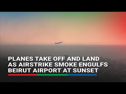 Planes take off and land as airstrike smoke engulfs Beirut airport at sunset