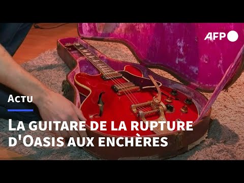 La guitare de la rupture d'Oasis aux enchères à Paris | AFP