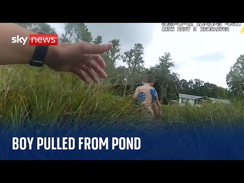Young boy pulled from pond after being 'kept afloat' by plants