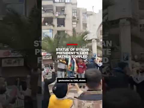 Syrian protestors topple statue of president’s late father