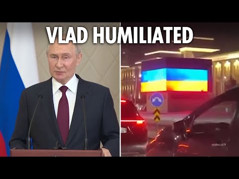 Moment Putin is HUMILIATED by 'hackers' as motorcade is forced to pass giant Ukraine flag