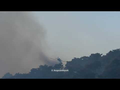 Three Air Tractor AT-802 perform water drops in west Chios island.