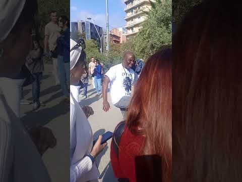 Image: Dr Charles Apoki Dancing in the Streets of Barcelona - Basílica de la Sagrada Família (U)