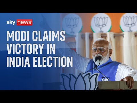 India election: Narendra Modi claims victory for his coalition - but party likely short of majority