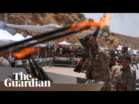Kurdistan Workers’ party fighters burn weapons in disarming ceremony