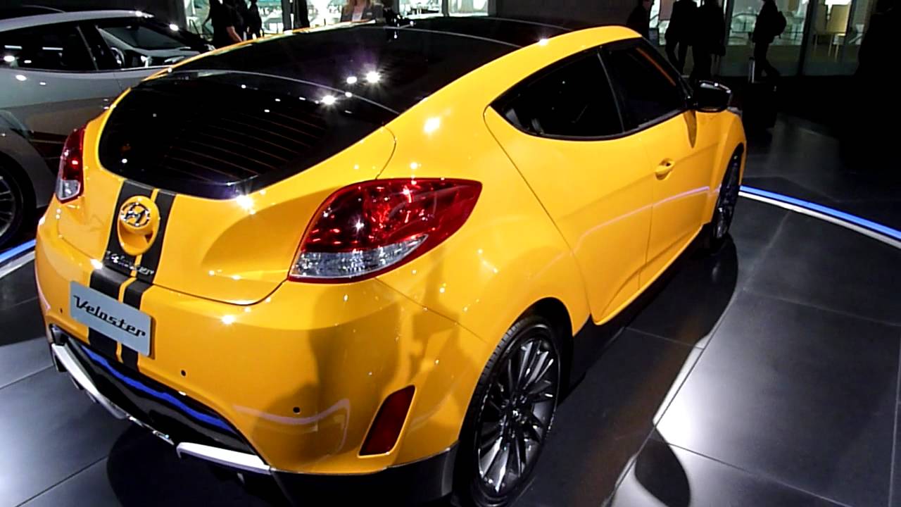 Sizzling yellow Hyundai Veloster sports coupe