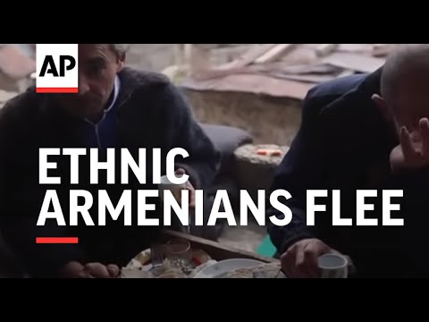 Ethnic Armenians flee as area turned to Azerbaijan