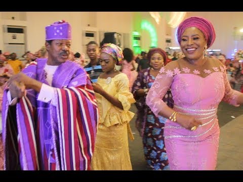 Beautiful Women surrounds King Sunny Ade as they dance and spray money at his daughter's Wedding