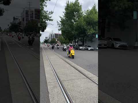 Amerivespa 2025 group ride to Oaks Park passes Vespa Portland