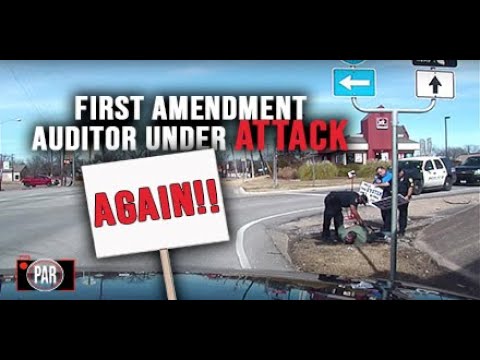 Police Arrest Man for Holding a Sign, But That Was Just the Beginning