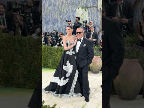 Anne Hathaway arrives with Michael Kors at the 2026 Met Gala