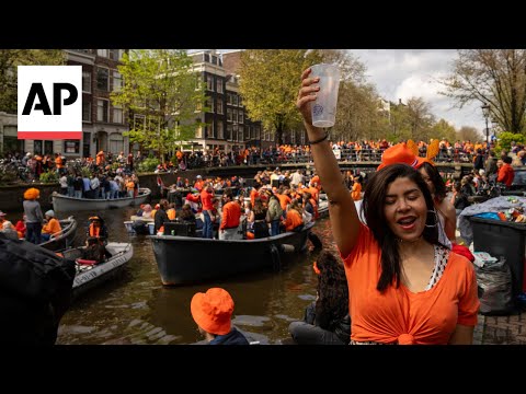 Dutch capital turns orange as revelers celebrate King's Day with colorful canal parade
