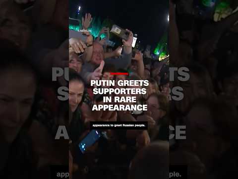 Putin greets supporters in rare appearance