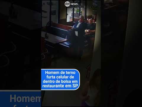 SP: Homem de terno é flagrado furtando celular de dentro de bolsa em restaurante