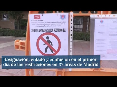 Resignación, enfado y confusión en el primer día de las restricciones en 37 áreas de Madrid