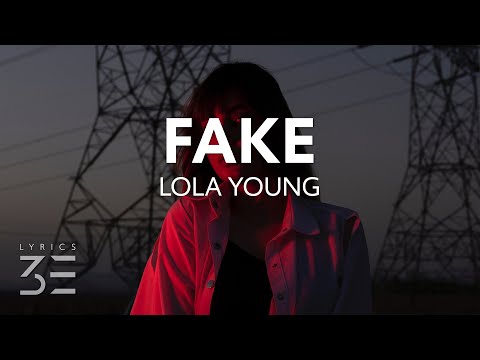 Lola Young - FAKE (Lyrics)