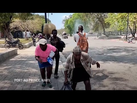 People run as bullets whizz overhead in another gang attack in Haiti