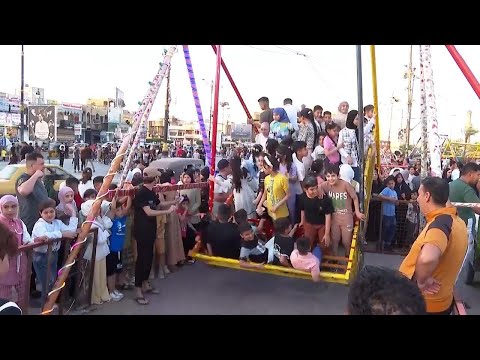 Families in Baghdad head to amusement park as they mark end of holy month of Ramadan