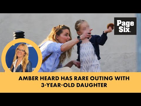 Smiling Amber Heard enjoys a sunny stroll with 3-year-old daughter Oonagh Paige in Spain