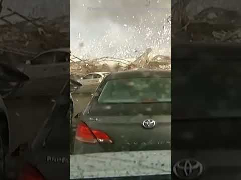 Dashcam video: Tornado destroys building